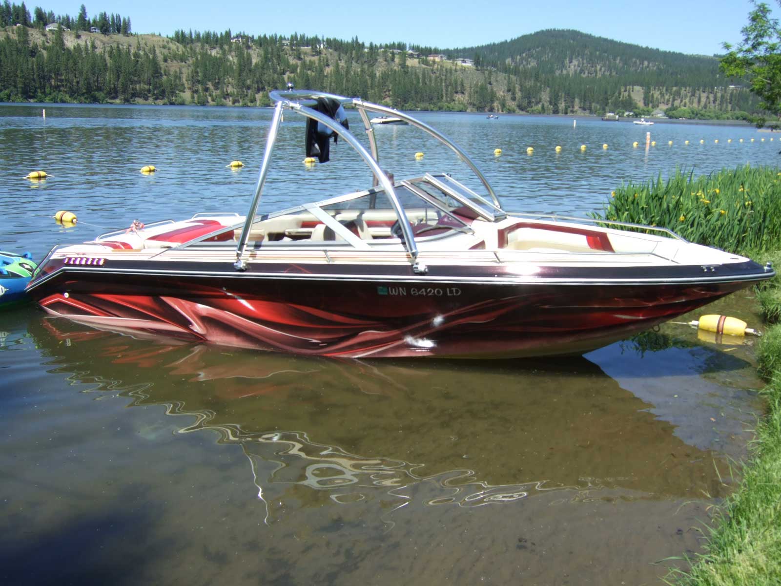 Other Vehicles - custom boat wrapped with patterned red vinyl