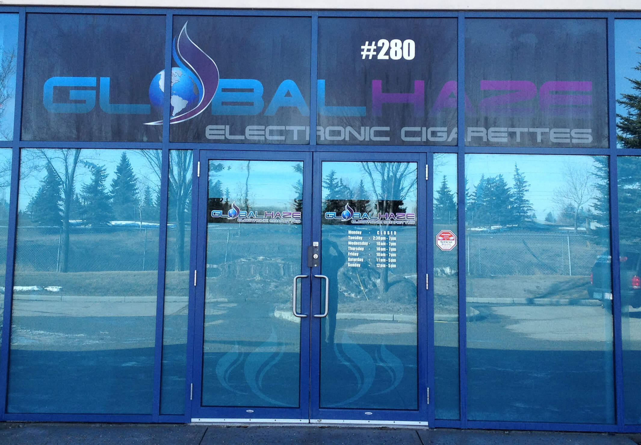 Storefront window graphics and privacy glass for e-cigarette store