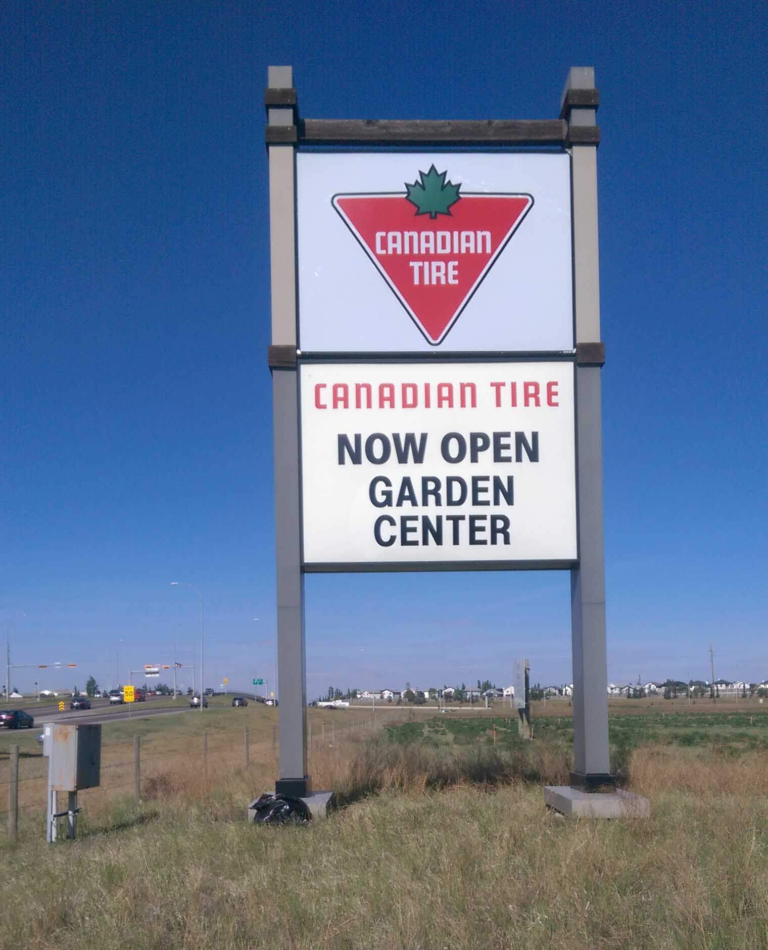 Cut vinyl lettering applied to existing sign face advertising the opening of the Canadian Tire Garden Center.