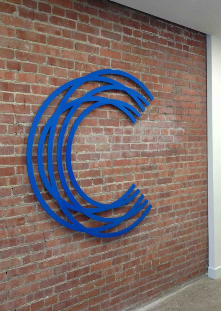 Lobby sign for the Calgary Chamber of Commerce made of powder coated aluminum